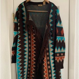 Women’s Wrangler Wrap Sweater with fringed opening.